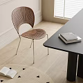 Wooden Dining Chair With Slatted Design Metal Legs Near Black Table On Light Wooden Floor