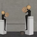 Two Modern Sculptures With Golden Heads Holding Geometric Cubes On White Pedestals