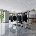 Modern Clothing Store Open Layout With Metal Racks Hanging Clothes And Floor to Ceiling Windows