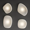 Four Modern White Irregular Pebble-like Wall Lights With Soft Glow On Dark Wall 3d model