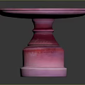 Pink Round Pedestal Table With Modern Smooth Surface And Decorative Base