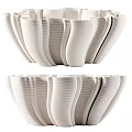 White Ribbed Ceramic Vessels With Unique Curved Shape For Decorative 3d model