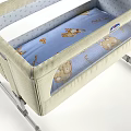 Comfortable Beige Baby Crib With Light Blue Mattress Bear Pattern And Metal Frame