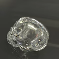 Transparent Crystal Skull Sculpture With Shiny Smooth Surface On Reflective Background