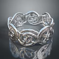 Elegant Silver Ring Featuring Intricate Intertwined Celtic Knot Design Patterns 3d model