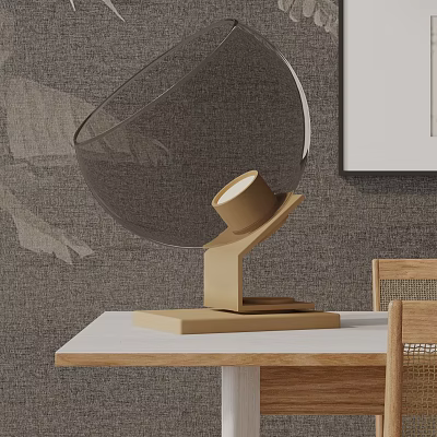 Elegant Round Glass Table Lamp With Metallic Base On Wooden Table Against Textured Wall 3d model
