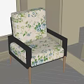 Single Seater Sofa with Floral Pattern Fabric Black Frame and Wooden Legs in Modern Living Room