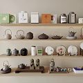 Elegant Tea Ware Collection On Wooden Shelves Featuring Ceramic Teapots And Tea Packages
