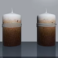 Two Decorative Candles With White Top Brown Bottom And White Stripes On Gray Background