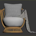 Cozy Rattan Chair with White Cushion Gray Geometric Pillow and Patterned Blanket