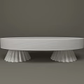 Round White Coffee Table With Sculpted Pleated Base And Sleek Surface
