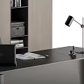 Modern Office Desk With Dell Laptop Open Book Pen Desk Lamp And Shelf With Books