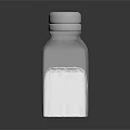 Clear Glass Salt Shaker With Perforated Lid Filled With White Table Salt For Kitchen Use