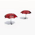 Two Red Umbrellas With Black Patterns On White Background
