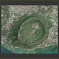 Aerial View Of Circular Green Natural Landscape Surrounded By Mountains And Coastal Residential Areas