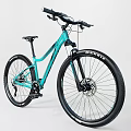 Teal Mountain Bicycle With Sturdy Frame Large Tires And Front Suspension Fork