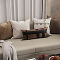 Stylish Decorative Sofa Pillows In Brown White With Black Strap Design On Beige Sofa