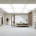 Modern Minimalist Clothing Store Interior With Clothing Racks Sofa And Mirror