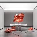 Red Carved Sculptures In Modern White Gallery With Round Table And Floor Artworks