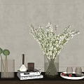 Clear Glass Vase With White Blossom Branches On Wooden Table With Books Candles And Decor