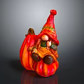 Gnome Figurine Sitting On Striped Orange Pumpkin With Red Orange Hat