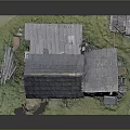 Old Wooden House With Gray Tiled Roof And Wooden Structure Near Small Shed On Grass