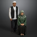 Two Muslim People In Traditional Clothing Standing And Sitting Against Gray Background