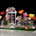 Floral Installation Featuring Decorative Door Large Colorful Flowers Bicycle Stand Caged Decorations And Grass Base