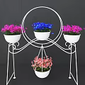 White Iron Garden Plant Stand With Multiple Flower Pots And Colorful Hanging Blooms