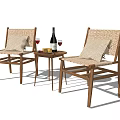 Wicker and Wooden Table and Chair Set With Wine Bottle Glasses And Fruit Plate