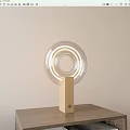 Modern Minimalist Table Lamp With Transparent Circular Shade And Wooden Base On Wooden Table