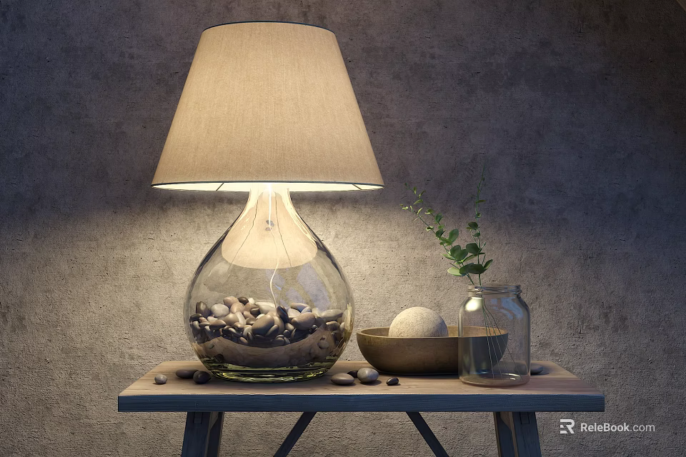 Table Lamp with Glass Base Fabric Shade Pebbles on Wooden Table and Green Plant 3d model 