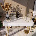 Modern Dressing Table With Golden Legs White Countertop Gray Chair Green Plant And Decorative Painting