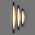 Modern Curved Black Wall Lamps with Warm Yellow Light on Gray Wall