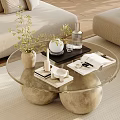 Modern Glass Top Coffee Table With Spherical Bases And Decorative Plants Candle Magazine In Living Room