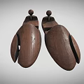 Two Wooden Shoe Stretchers With Natural Wood Construction And Top Knob Design