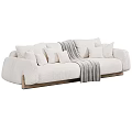 Green And Beige Sectional Sofa With Multiple Cushions Gray Blanket And Wooden Legs