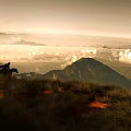 Game Movie Characters Riding Horses On Mountain Peak Above Sea Of Clouds At Sunset