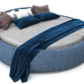 Stylish Round Bed Interior Design With Gray Mattress Blue Blanket And Assorted Pillows