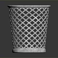 Silver Metal Trash Can With Diamond Lattice Design On Black Surface And Reflection