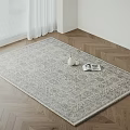 Square Rug with Decorative Pattern on Herringbone Wooden Floor with White Curtains Vase and Books