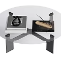 Modern Glass Top Coffee Table With Metal Frame And Remote Control On Surface