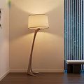 Modern Floor Lamp With Curved Stand And Beige Shade In Living Room With Wooden Floor