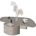Modern Marble Coffee Table With Irregular Shape Adorned With Dried Flower Vase Sculpture And Books