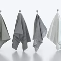Soft Textured Gray And White Towels Hanging On Hooks Against Clean Minimalist Background