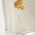 Elegant Gold Leaf Shaped Floor Lamp With Modern Curved Stem Design 3d model