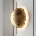 Golden Spherical Wall Light With Moon Surface Texture Mounted On White Wall 3d model