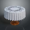 Round Table With White Tablecloth Featuring Black Floral Pattern And Wooden Base 3d model