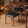 Wooden Dining Chairs With Curved Backrest And Black Leather Seats Near Table