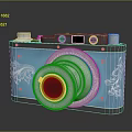 Vintage Camera With Blue Body Silver Lens And Decorative Floral Patterns